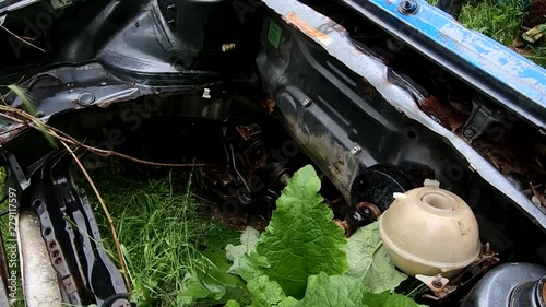 SLOWMO ruined car in Metelkova city photo