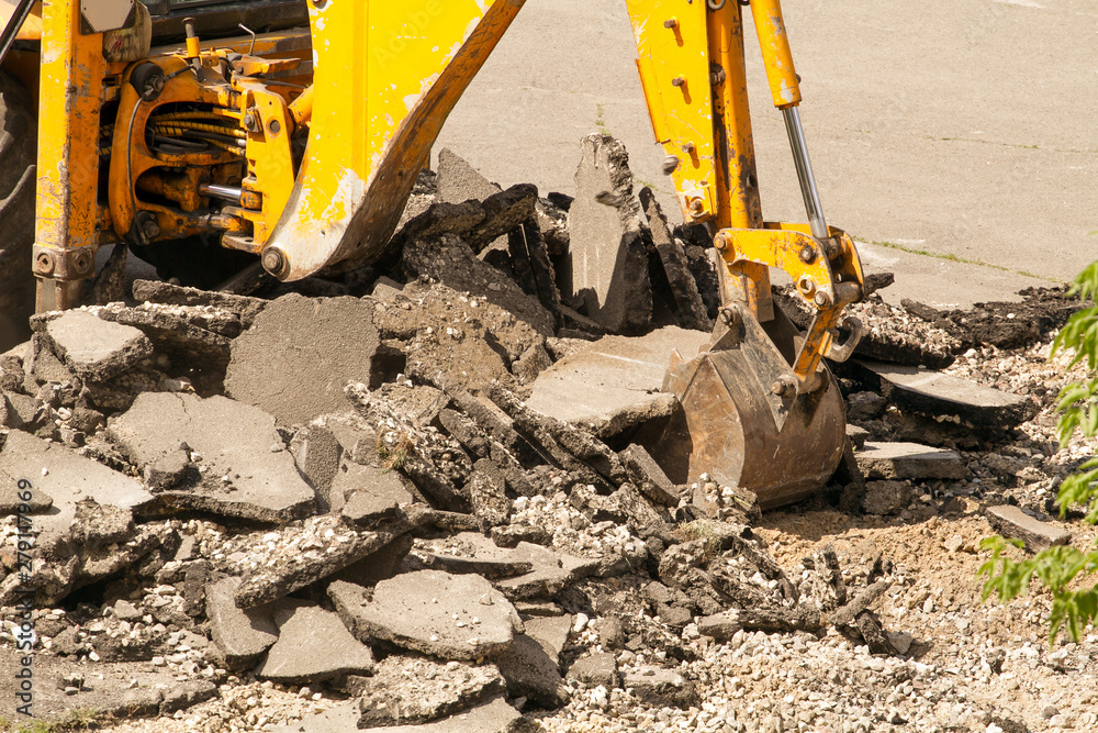 Fototapeta premium Tractor Dismantles Asphalt