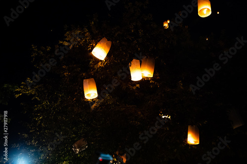 Loi Krathong and Yi Peng released paper lanterns on the sky during night © Gabriel