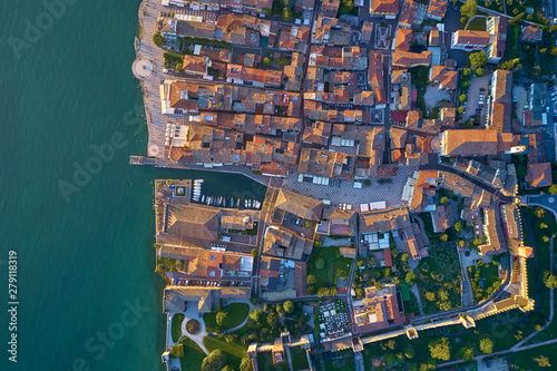 Panoramic view of the city center of Lazise on Lake Garda  Italy. Aerial photography with drone.