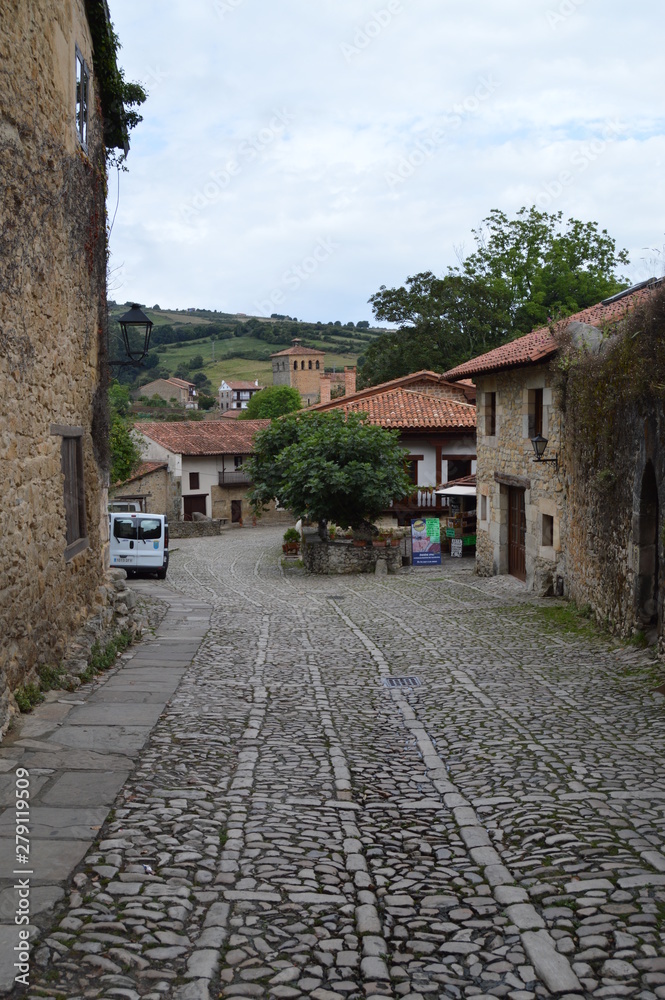 Beautiful Medieval Racial Street In Santillana Del Mar. August 26, 2013. Santillana Del Mar, Cantabria. Vacation Nature Street Photography. Beautiful Medieval Racial Street In Santillana Del Mar. August 26, 2013. Santillana Del Mar, Cantabria. Vacation Nature Street Photography.
