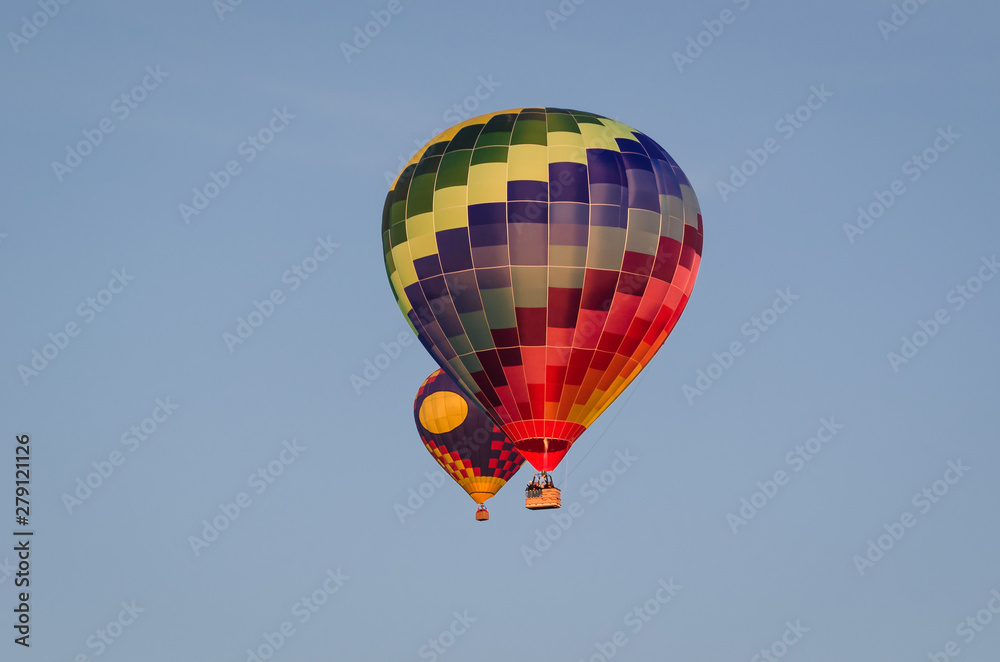 HOLIDAY ADVENTURES - Flight of balloons on a blue sky HOLIDAY ADVENTURES - Flight of balloons on a blue sky