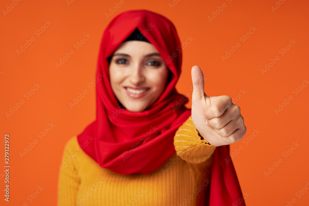 young woman with thumbs up
