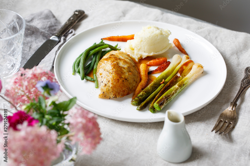 Roast dinner with chicken, baby leeks, carrots, green beans and potato mash