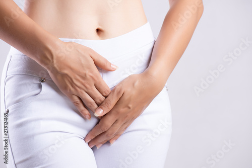 Young Sick Woman With Hands Holding Pressing Her Crotch Lower Abdomen Stock  Photo - Download Image Now - iStock