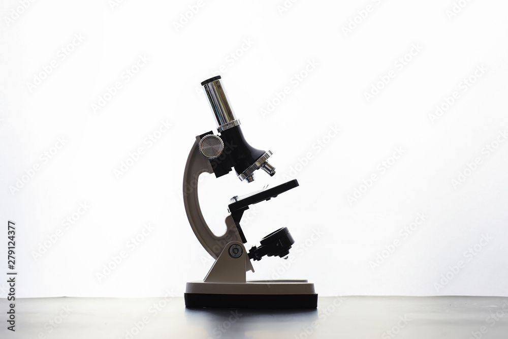 Research laboratory. Test tubes and microscope on the table on a white background. Research laboratory. Test tubes and microscope on the table on a white background.