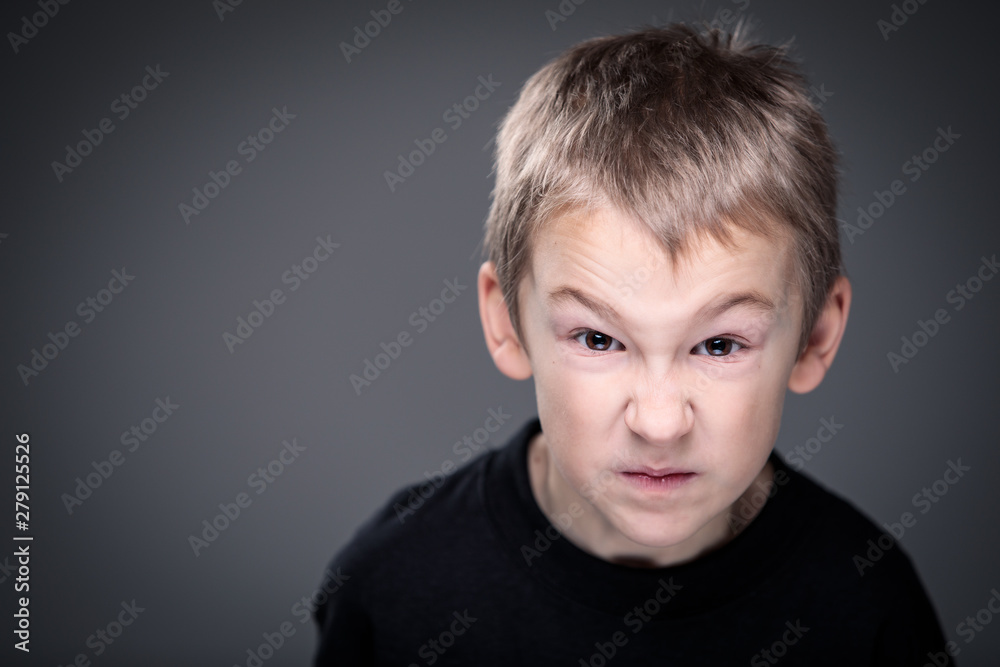 Loads of aggression in a little boy - education concept hinting behavioral problems in young children (shallow DOF) - little boy with hands clenched into fists about to punch someone Loads of aggression in a little boy - education concept hinting behavioral problems in young children (shallow DOF) - little boy with hands clenched into fists about to punch someone