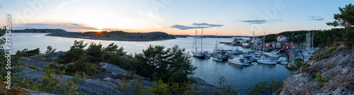 View into the sailing and fishing harbour of Res   during sunset  western Sweden.