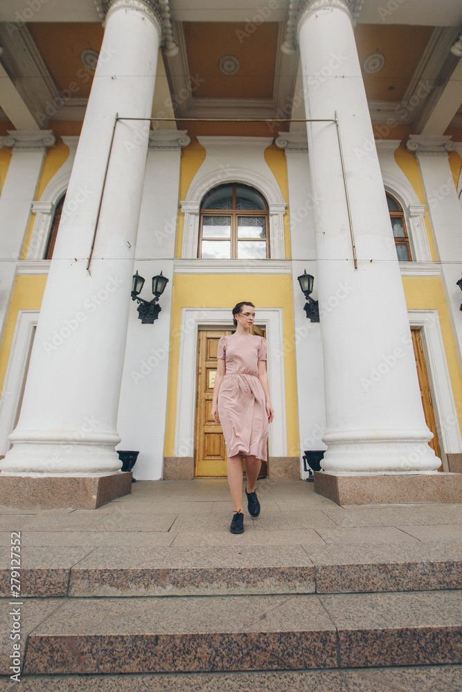 portrait of a beautiful girl near the columns of the theater or Museum portrait of a beautiful girl near the columns of the theater or Museum