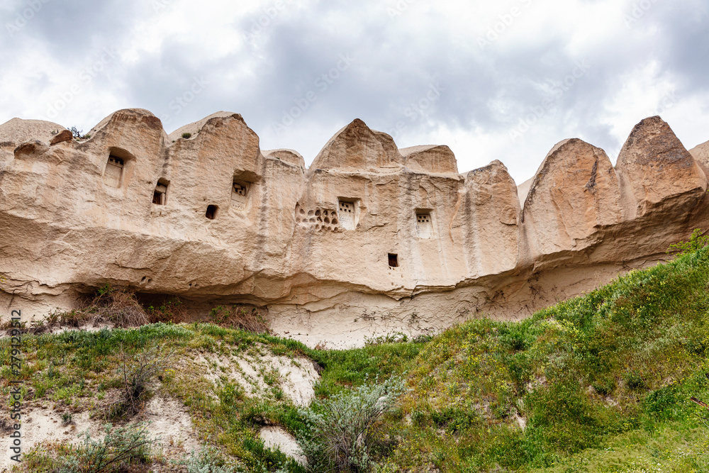 Caves in the sandy mountains of Cappadocia. Beautiful landscape. Caves in the sandy mountains of Cappadocia. Beautiful landscape.