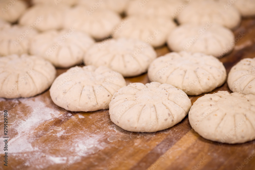 balls of dough bread getting ready to be baked balls of dough bread getting ready to be baked