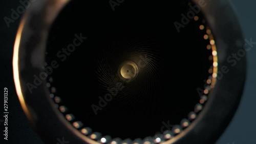 Single golden bullet loaded to a revolver in a game of russian roulette. 4KHD