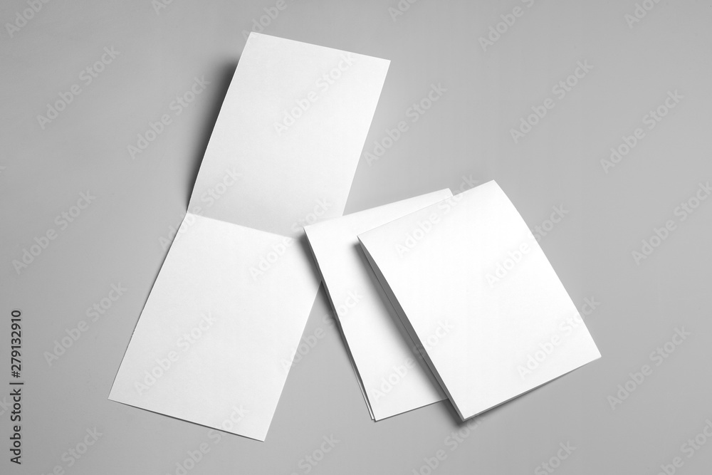 Blank half-folded booklet, postcard, flyer or brochure mockup template on gray background Blank half-folded booklet, postcard, flyer or brochure mockup template on gray background
