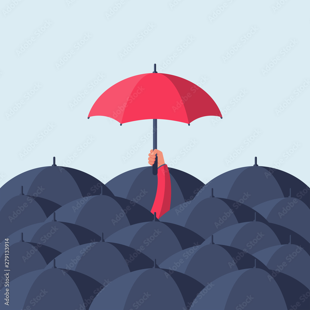 Uniqueness and individuality. Man holding a red umbrella among people with black umbrellas