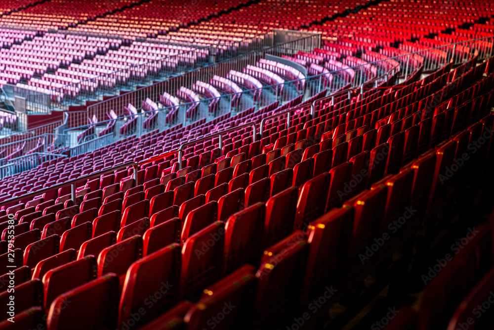 Fototapeta premium Vacant red chairs of stadium stand