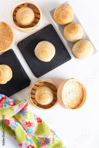 Oriental food concept homemade organic Huaiyang Spiral Chinese flaky  pastry moon cake on white background with copy space photo