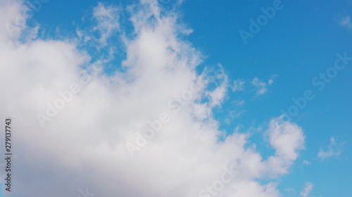 White clouds floating in the blue sky.