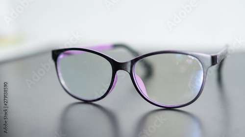 Clear glasses placed on a blurred background