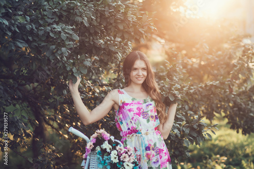 happy romantic girl in summer dress at sunset