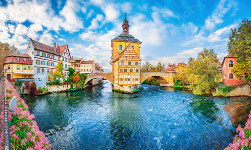 Old town Bamberg in Bavaria, Germany. Romantic  historical town on Romantic road in Bavaria,  located on crossing of Regnitz and Main rivers. Autumn view of old Timber Framing architecture and flowers photo