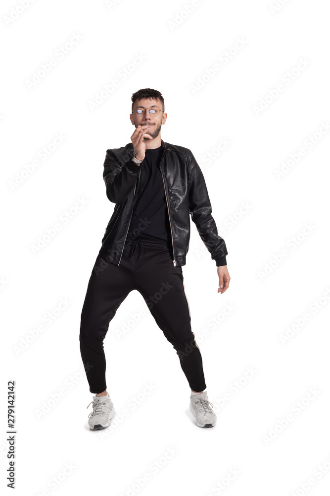 Full-length photo of a funny guy dancing in studio isolated on white background. Full-length photo of a funny guy dancing in studio isolated on white background.
