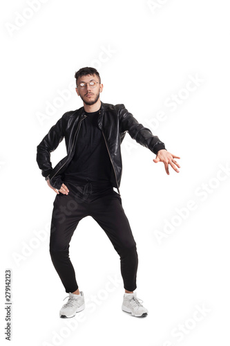 Full-length photo of a funny guy dancing in studio isolated on white background.