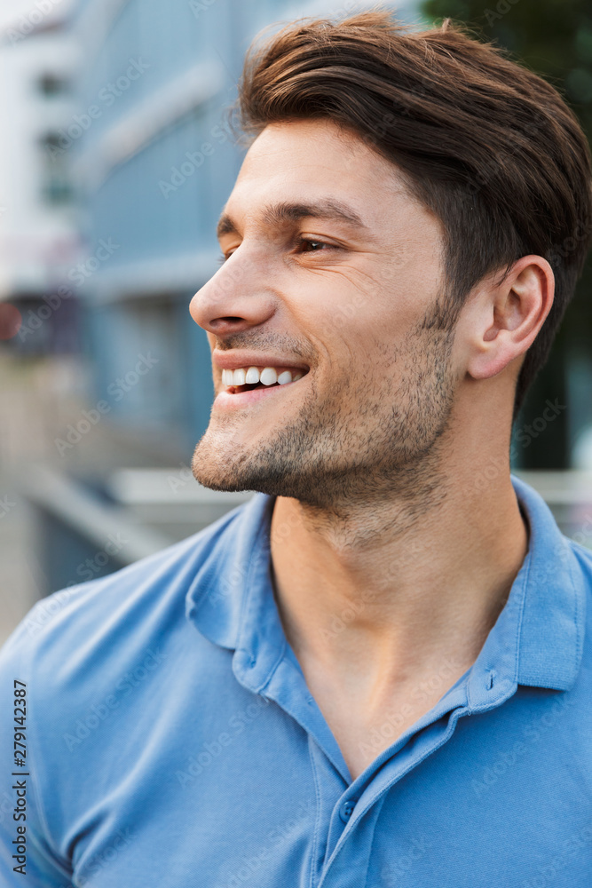 Fototapeta premium Handsome young man dressed casually spending time outdoors