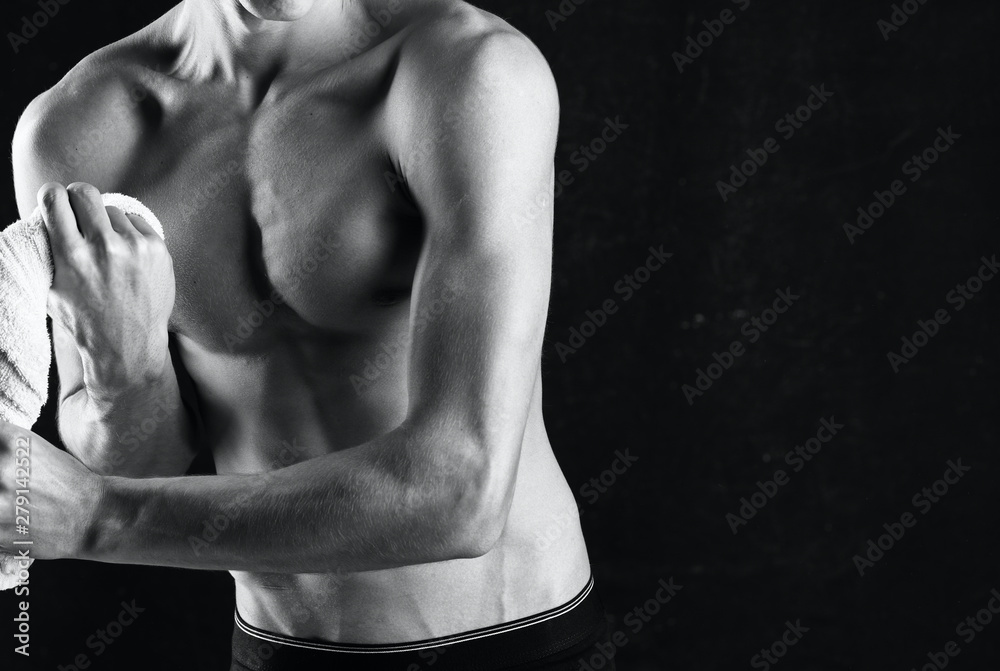 muscular man posing on black background muscular man posing on black background