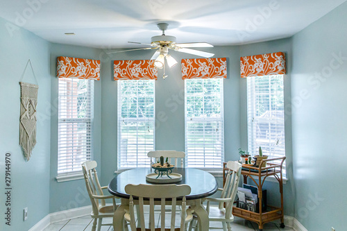 Light Blue Eat-In Dining Room next to the kitchen with a tile floor, table and chairs