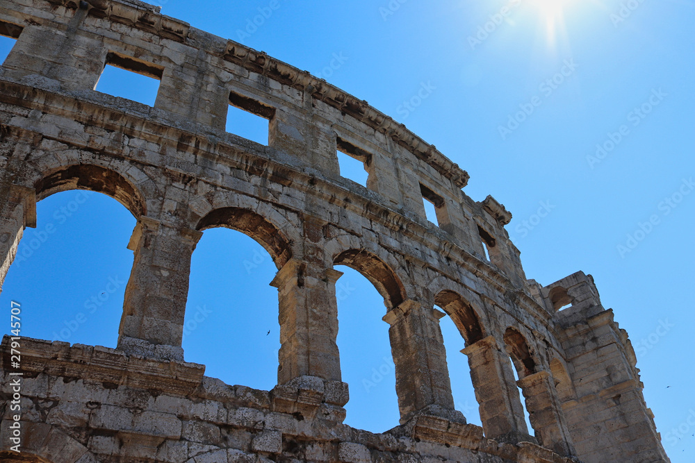 the colosseum in rome at summertime