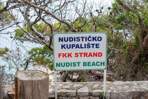 Fototapeta Naklejka Na Ścianę i Meble -  Nudist Beach sign on Lokrum Island Croatia