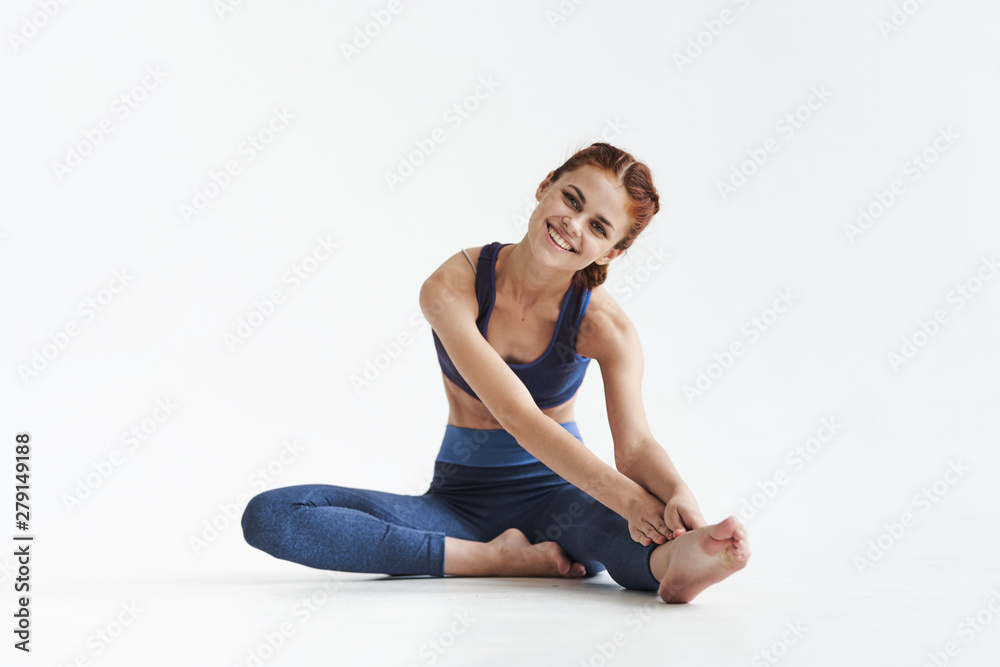 woman sitting on the floor isolated on white woman sitting on the floor isolated on white