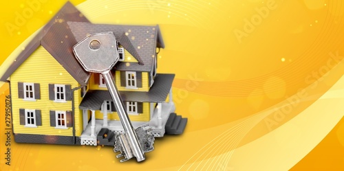 Architecture  building  mortgage  real estate and property concept - close up of home model and house keys