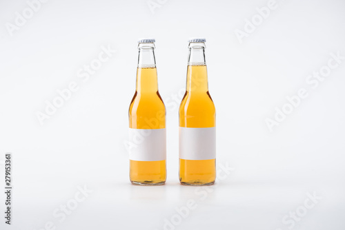 two bottles of beer with white blank labels on white background