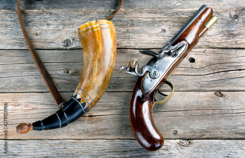 Antique Flintlock Pistol and Gunpowder Horn. photo