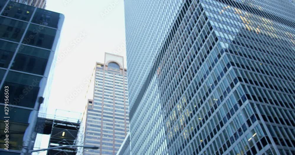 Impressive Skyscrapers In Incredible Manhattan NYC From A Car On a Iconic New York Road With Classic Yellow Traffic Lights Impressive Skyscrapers In Incredible Manhattan NYC From A Car On a Iconic New York Road With Classic Yellow Traffic Lights