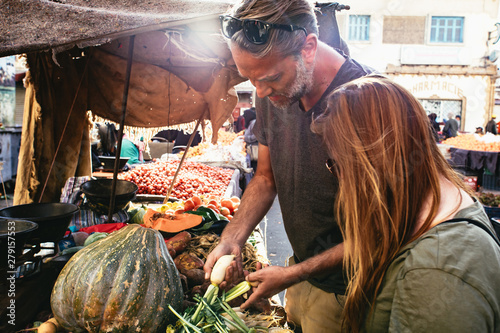 Man and woman shopping for fresh vegetables