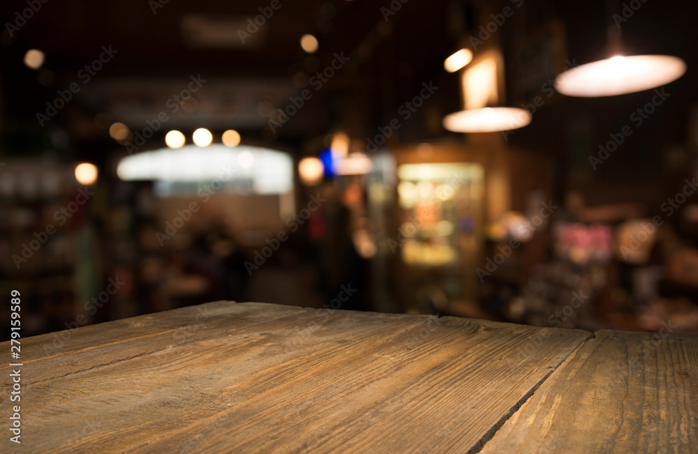 Beer barrel with beer glasses on a wooden table. The dark brown background.