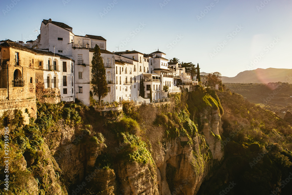 Cliff top houses above El Tajo George with flare