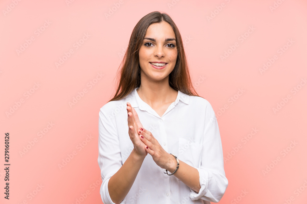 Young woman over isolated pink background applauding Young woman over isolated pink background applauding