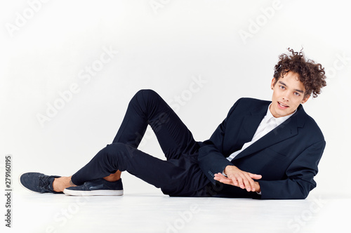 young man sitting on the floor with laptop