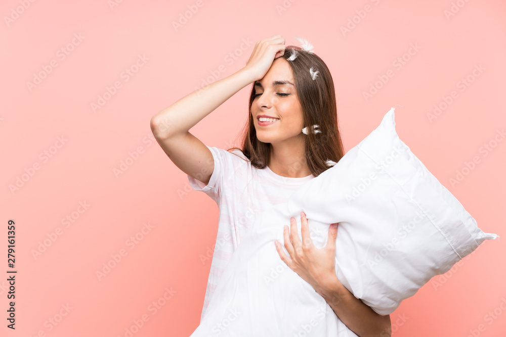 Young woman in pajamas over isolated pink background has realized something and intending the solution Young woman in pajamas over isolated pink background has realized something and intending the solution