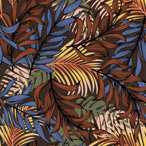 Summer abstract seamless pattern with colorful tropical leaves and plants on a brown background. Vector design. Jungle print. Flowers background. Printing and textiles. Exotic tropics. Fresh design. © EltaMax99