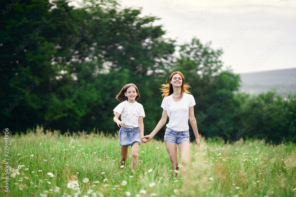 mother and daughter in the field mother and daughter in the field