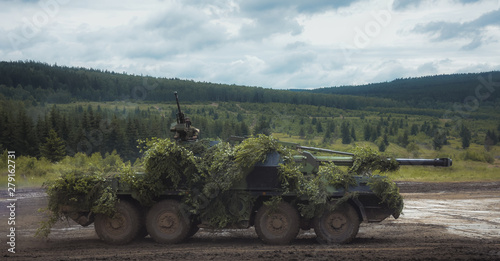 Armored military vehicle commuting from his hiding place.