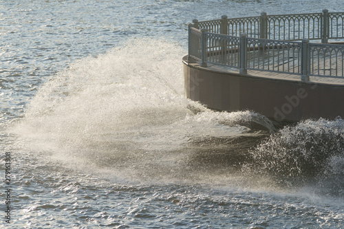 Fountain in the Moskva River near base of monument of Peter the Great made of Zurab Tsereteli in summer day. Famous historical monument in natural light. High resolution image.