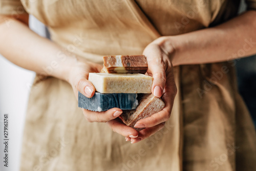 A Woman Holding Soaps