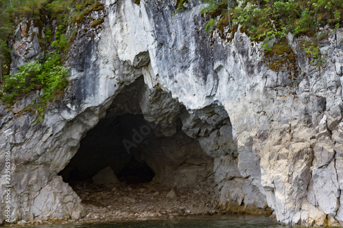 The rocky shore of the Krasnoyarsk reservoir. The Krasnoyarsk Sea. Rocky coast with trees. Cave..