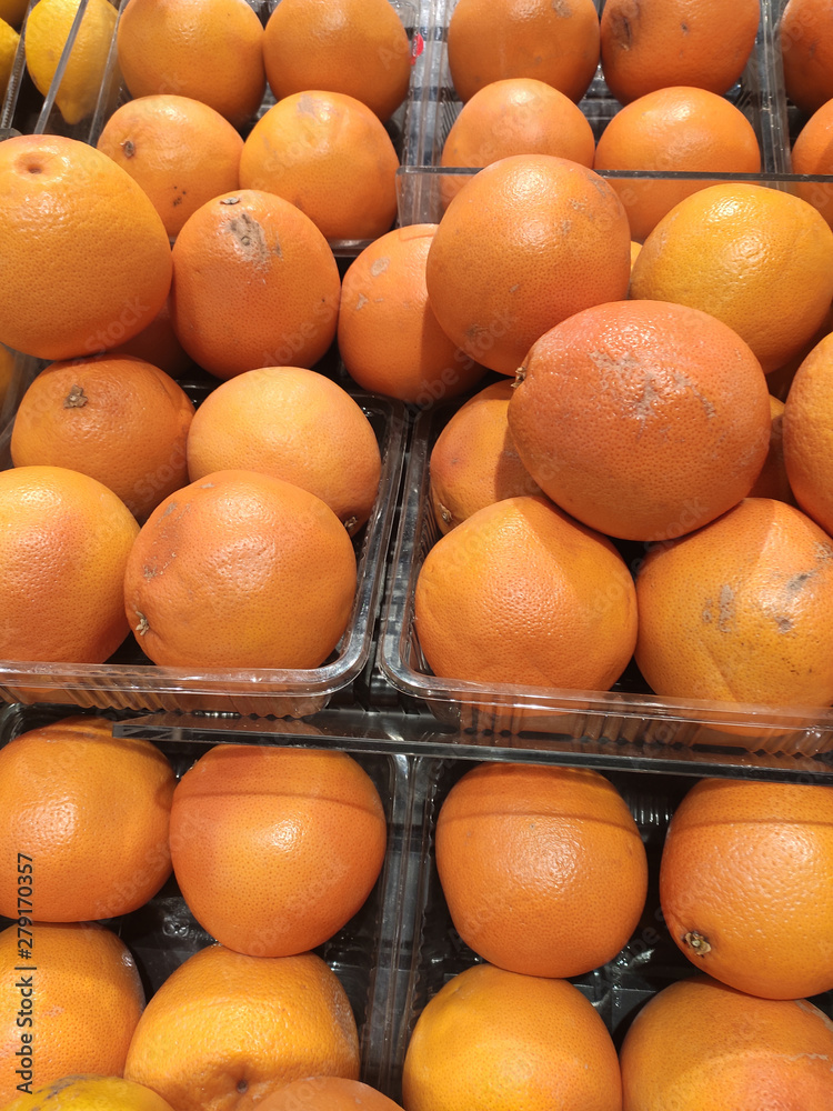 Orange fruit on rack for sale in the supermarkets. 