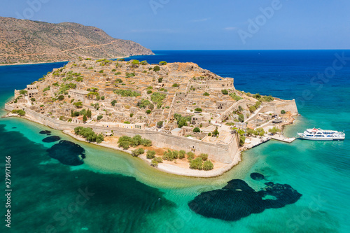 Aerial view of tourist boats on the ruins of the fortress and former leper colony island of Spingalonga (Elounda, Crete, Greece)